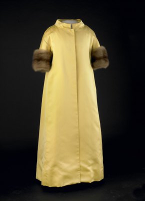 The yellow satin gown and sable-trimmed coat worn to the inaugural balls by Lady Bird Johnson in 1965.